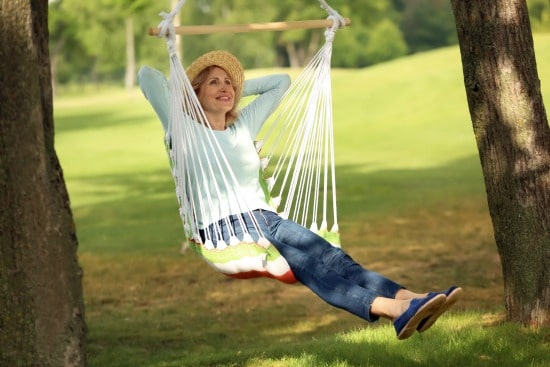 Senior Woman sittng in swing