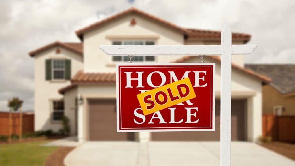 Sold Real Estate Sign and House 