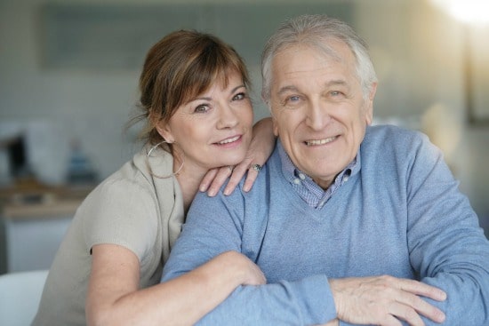 Senior Couple Smiling at Camera